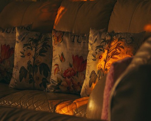 Cozy evening lighting in a living room with someone relaxing